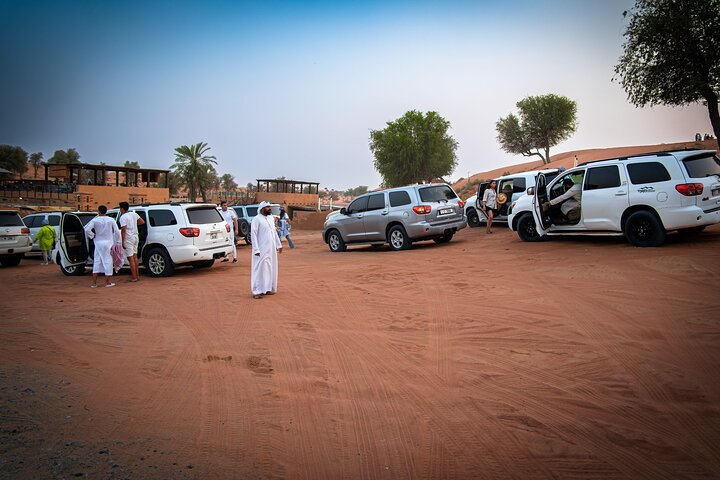 Experience the magic of the Dubai desert with luxury SUVs ready to take you on an adventure. Enjoy gourmet dining and explore the stunning sands creating memories under starry skies.